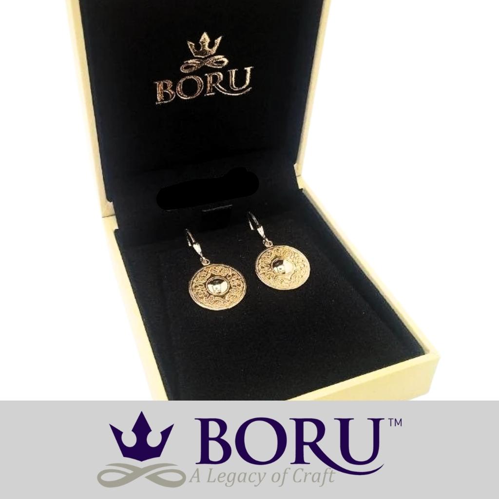 Gold earrings in a Boru box with Boru branding.