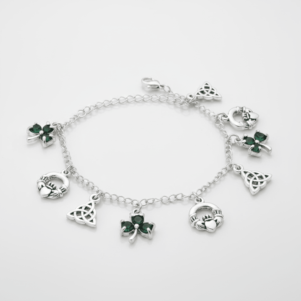 Silver bracelet with green gemstone charms on a white background