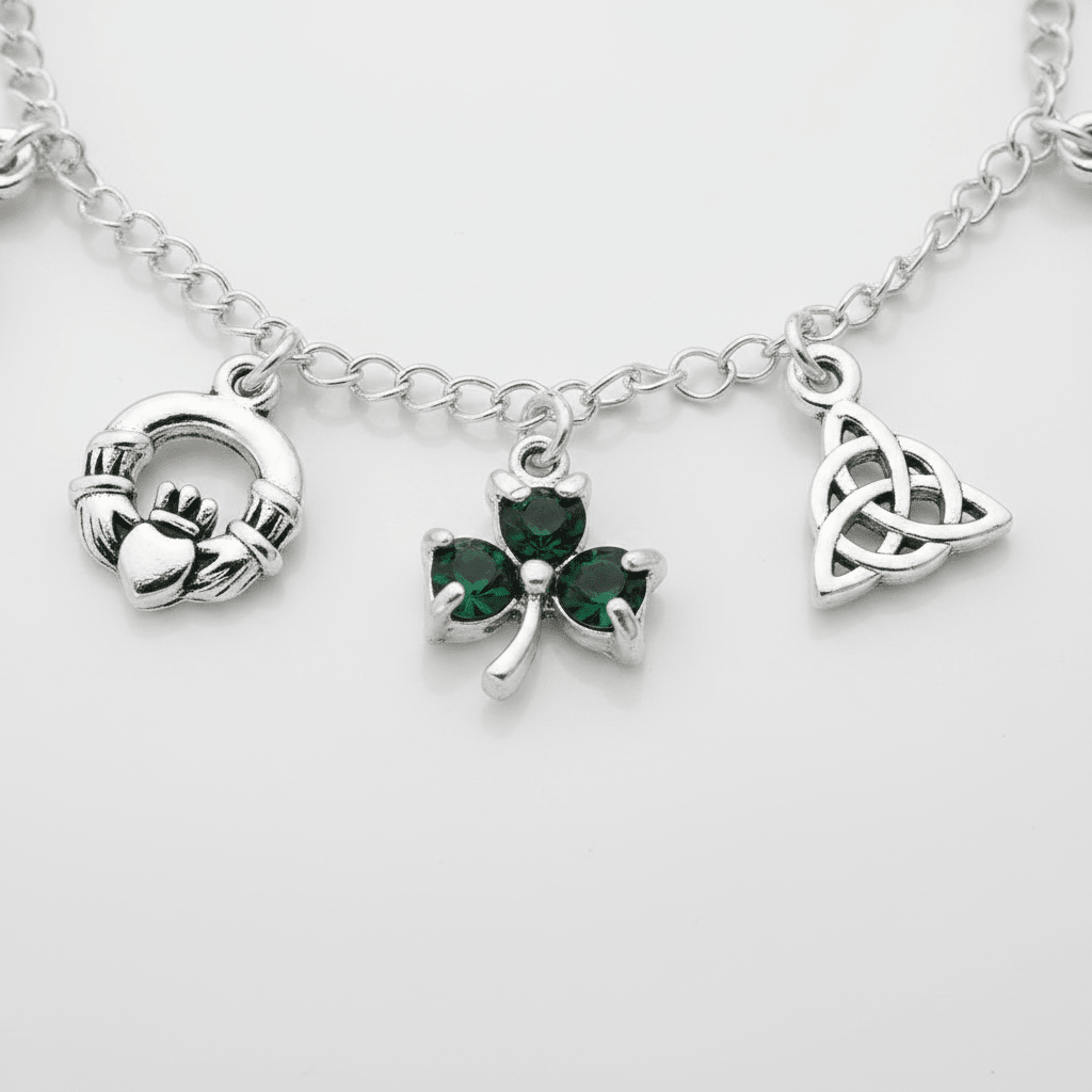 Silver bracelet with Claddagh, shamrock, and Trinity knot charms on a white background